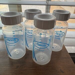 Dr. Brown's Baby Bottles with white Caps to store milk